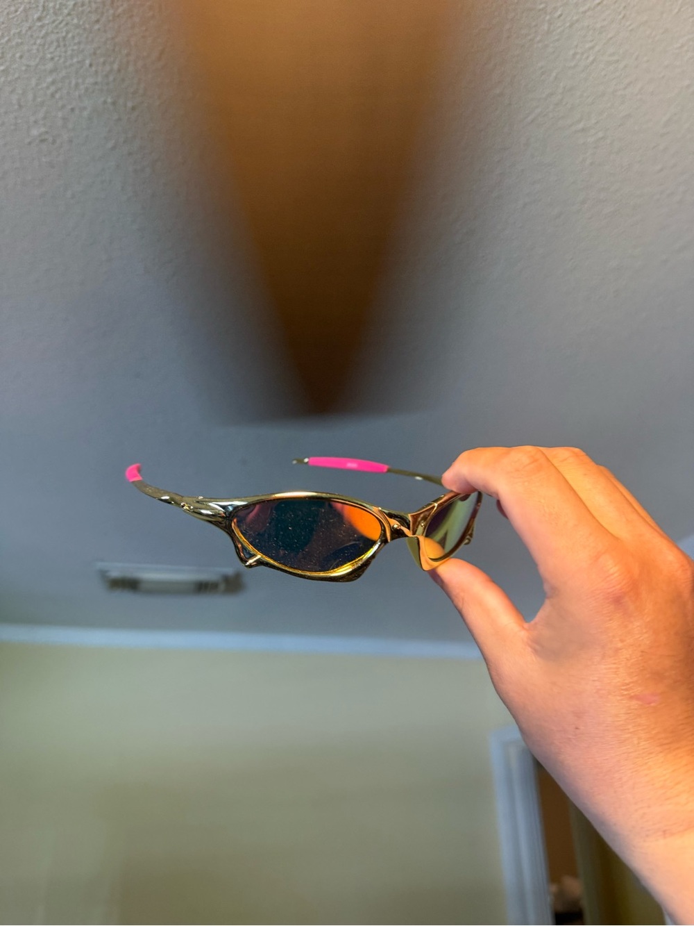 Sporty Wrap Sunglasses with Pink Temple Tips Oakleys